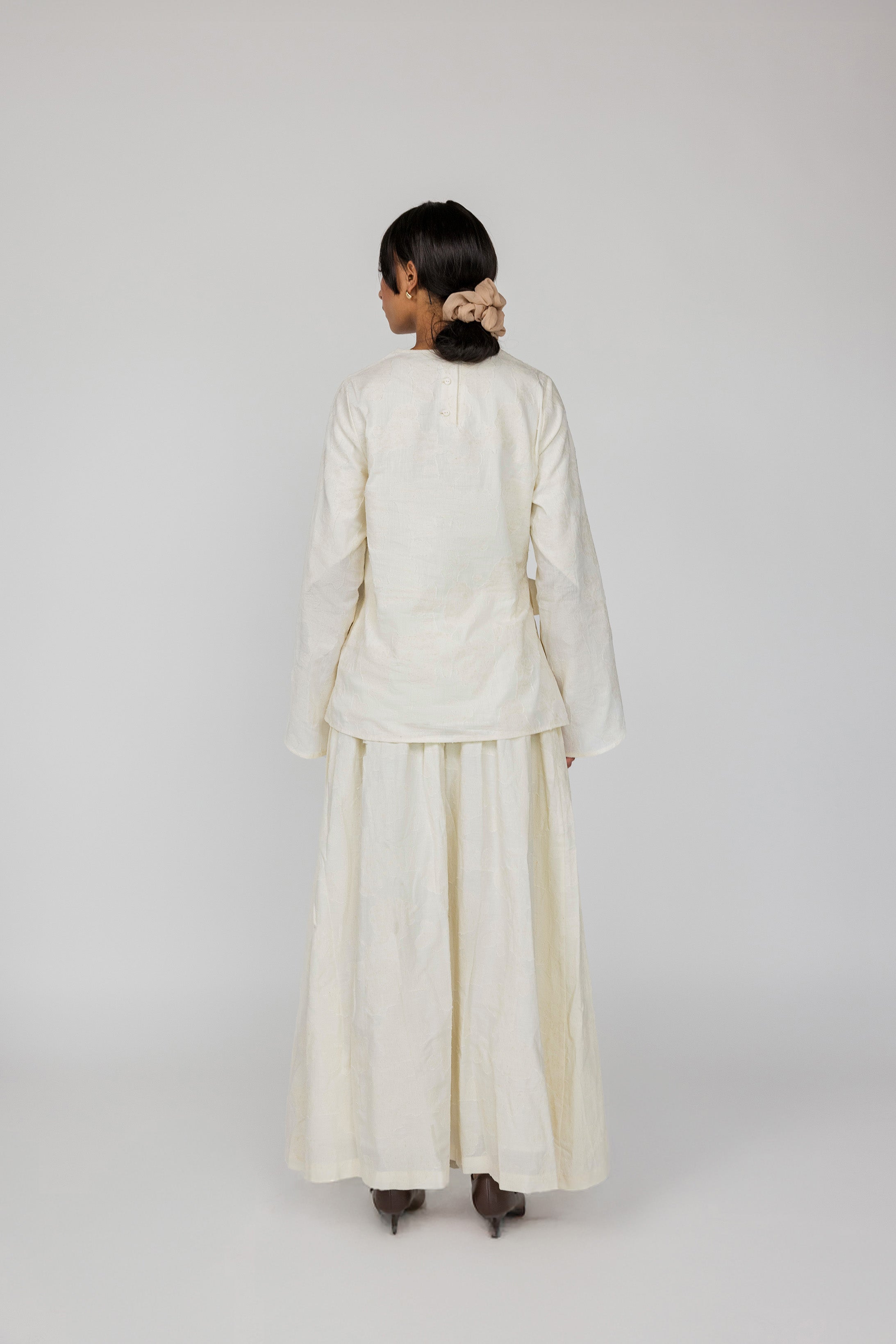 VELA tie front top in cream with a subtle woven texture and elegant drape.