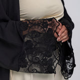 Elegant abaya featuring soft draping and subtle lace accents along the edges
