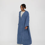 Tweed abaya with a loose fit and luxe finish, made for comfort and sophistication