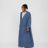 Tweed abaya with a loose fit and luxe finish, made for comfort and sophistication