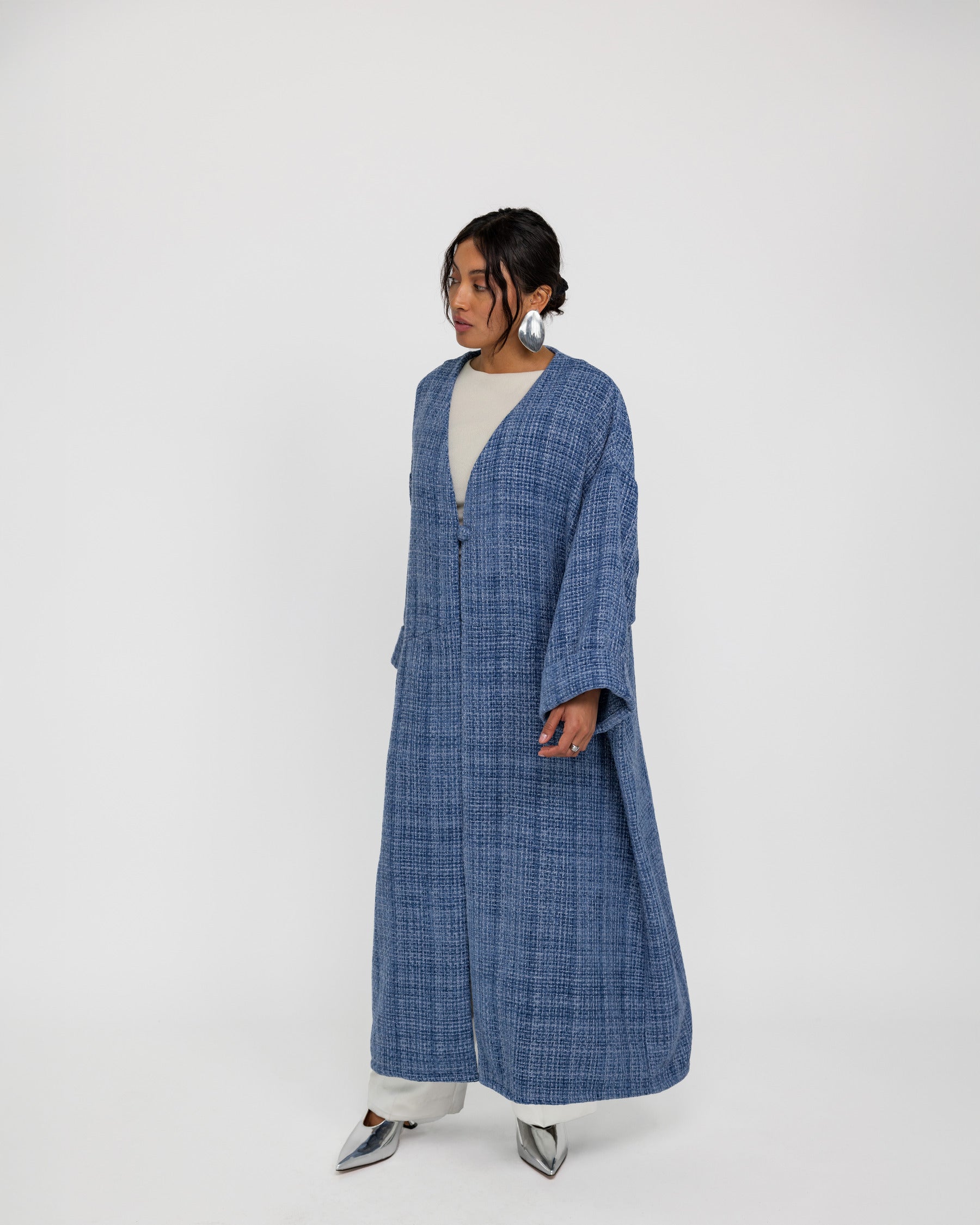 Tweed abaya with a loose fit and luxe finish, made for comfort and sophistication