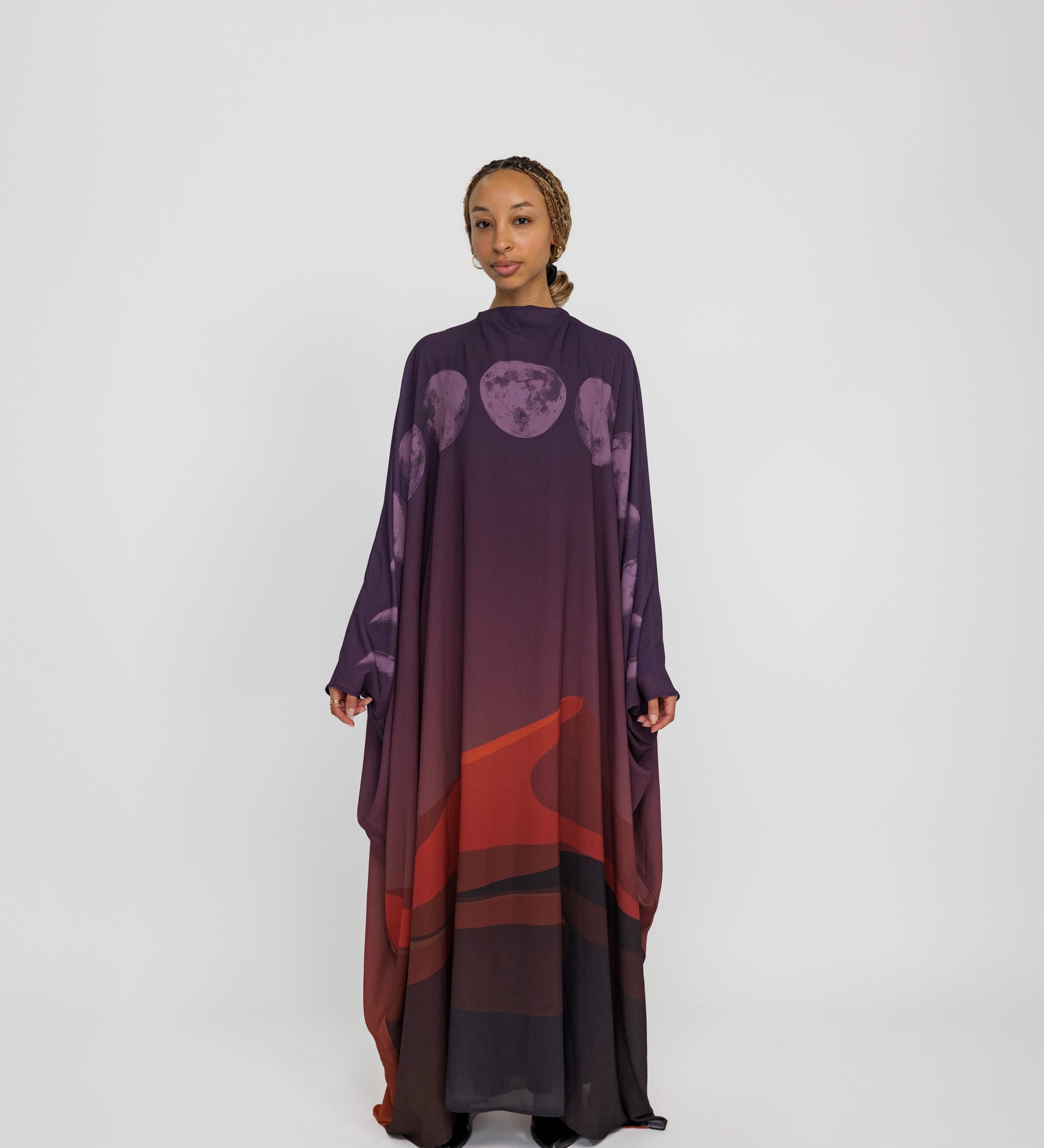 Sheer kaftan abaya with moon phase detailing, inspired by desert skies and lunar cycles