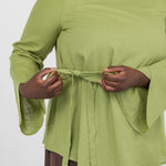 Easy-fitting top with a front tie and comfortable shape, great for layering or wearing alone.