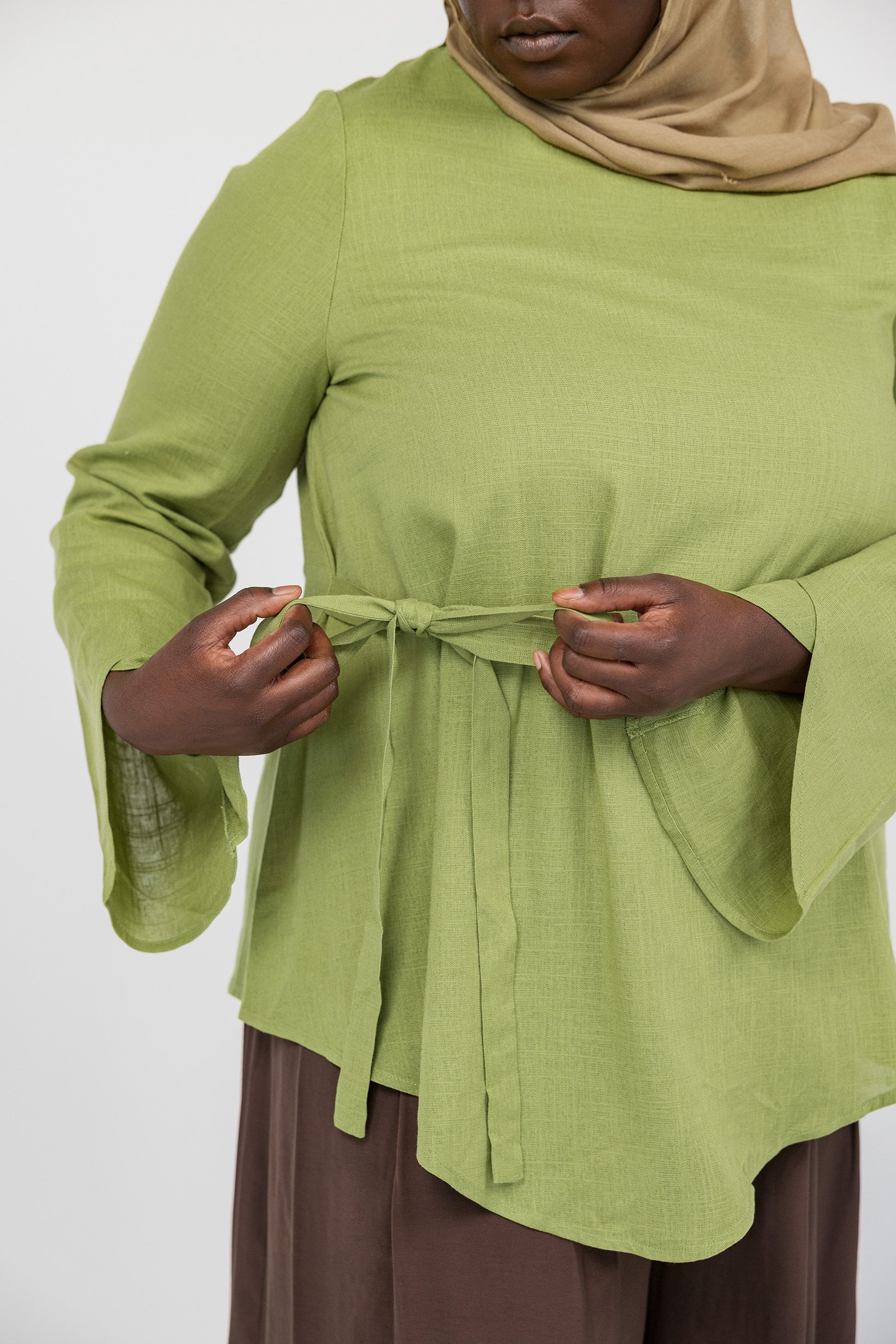 Easy-fitting top with a front tie and comfortable shape, great for layering or wearing alone.
