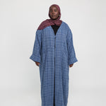 Layering abaya made from structured tweed, blending warmth with refined design
