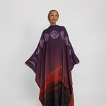 Statement kaftan abaya featuring moon-inspired accents and a soft, sheer finish