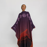 Statement kaftan abaya featuring moon-inspired accents and a soft, sheer finish