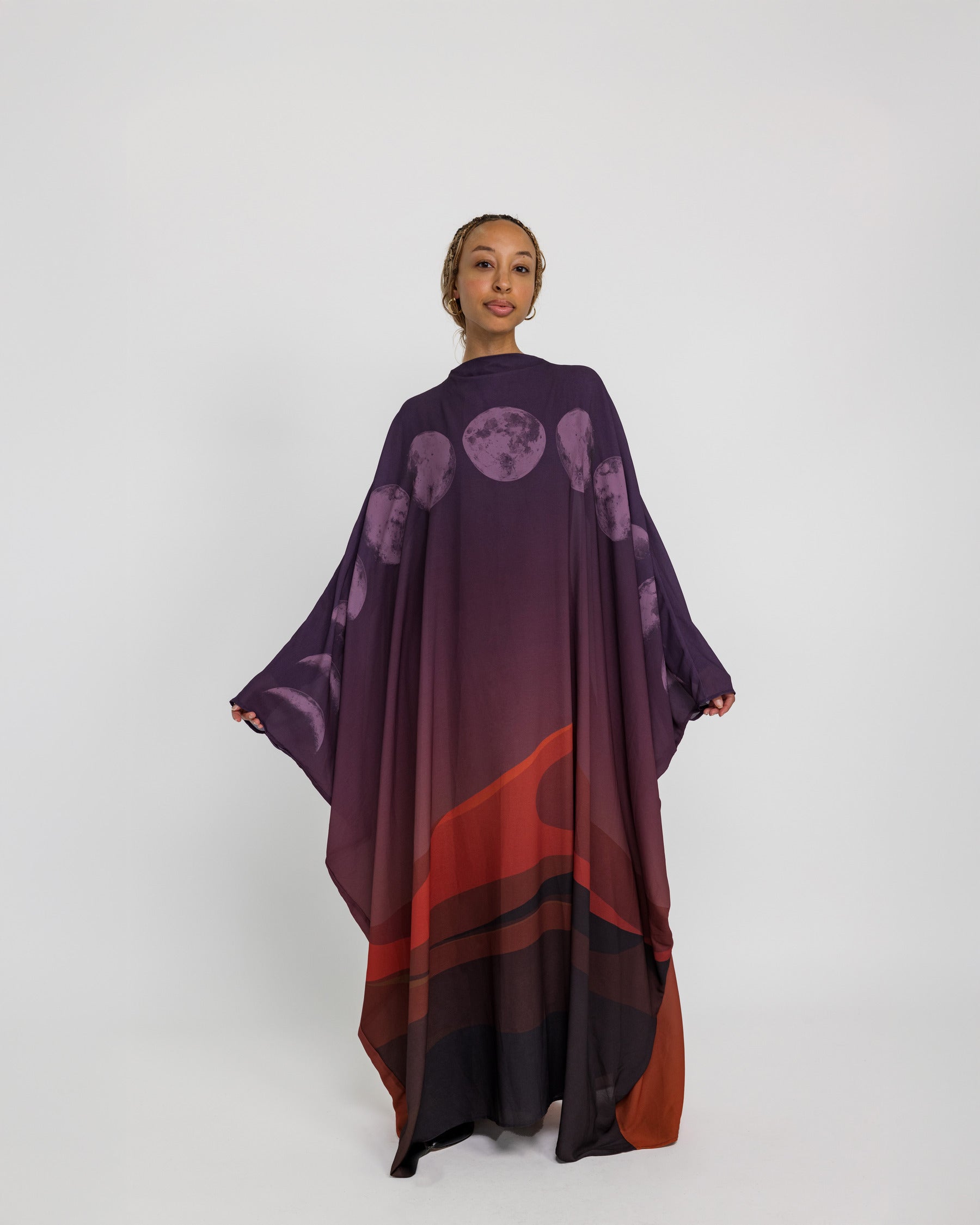 Statement kaftan abaya featuring moon-inspired accents and a soft, sheer finish