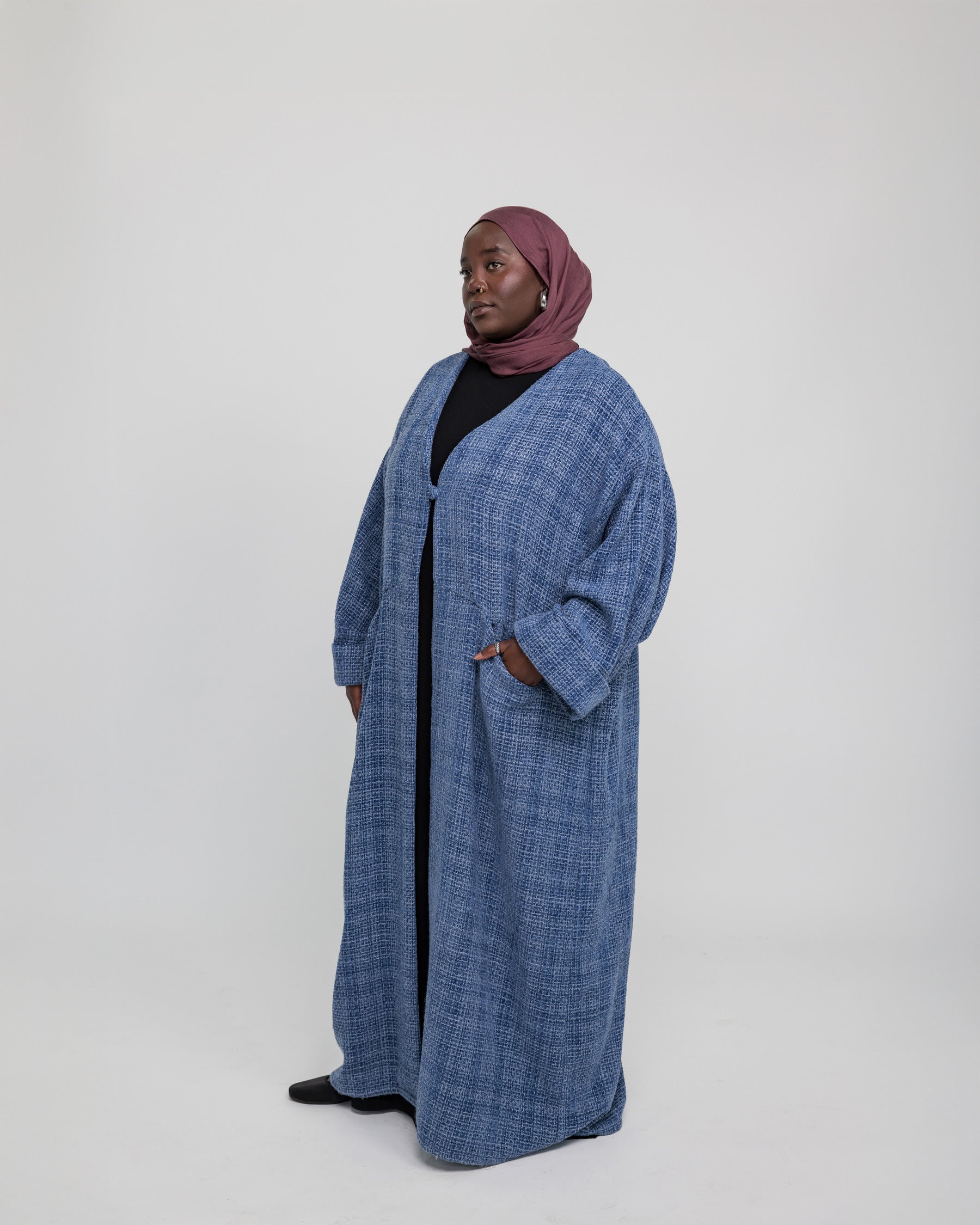 Relaxed-fit tweed abaya with a premium texture and soft, flowy shape