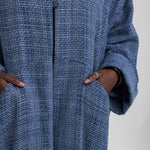 Full-coverage abaya in heavyweight tweed, designed to add dimension to your wardrobe