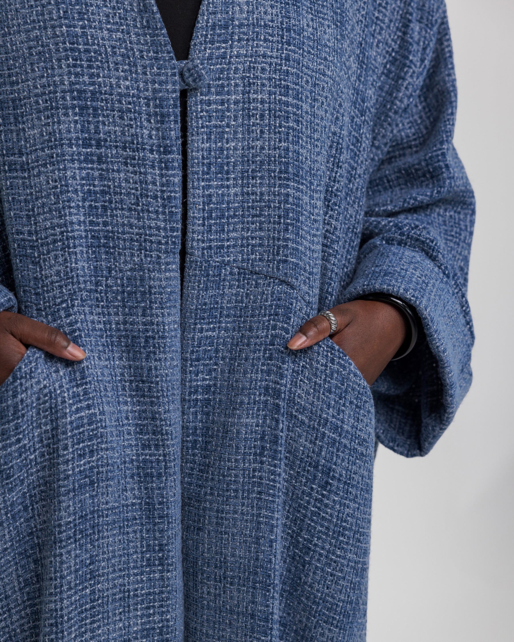 Full-coverage abaya in heavyweight tweed, designed to add dimension to your wardrobe