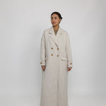 Oversized trench-style abaya coat with tailored details and fluid structure