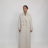 Oversized trench-style abaya coat with tailored details and fluid structure