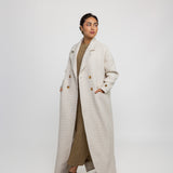 Outerwear abaya designed with trench coat elements and a soft, draped fit