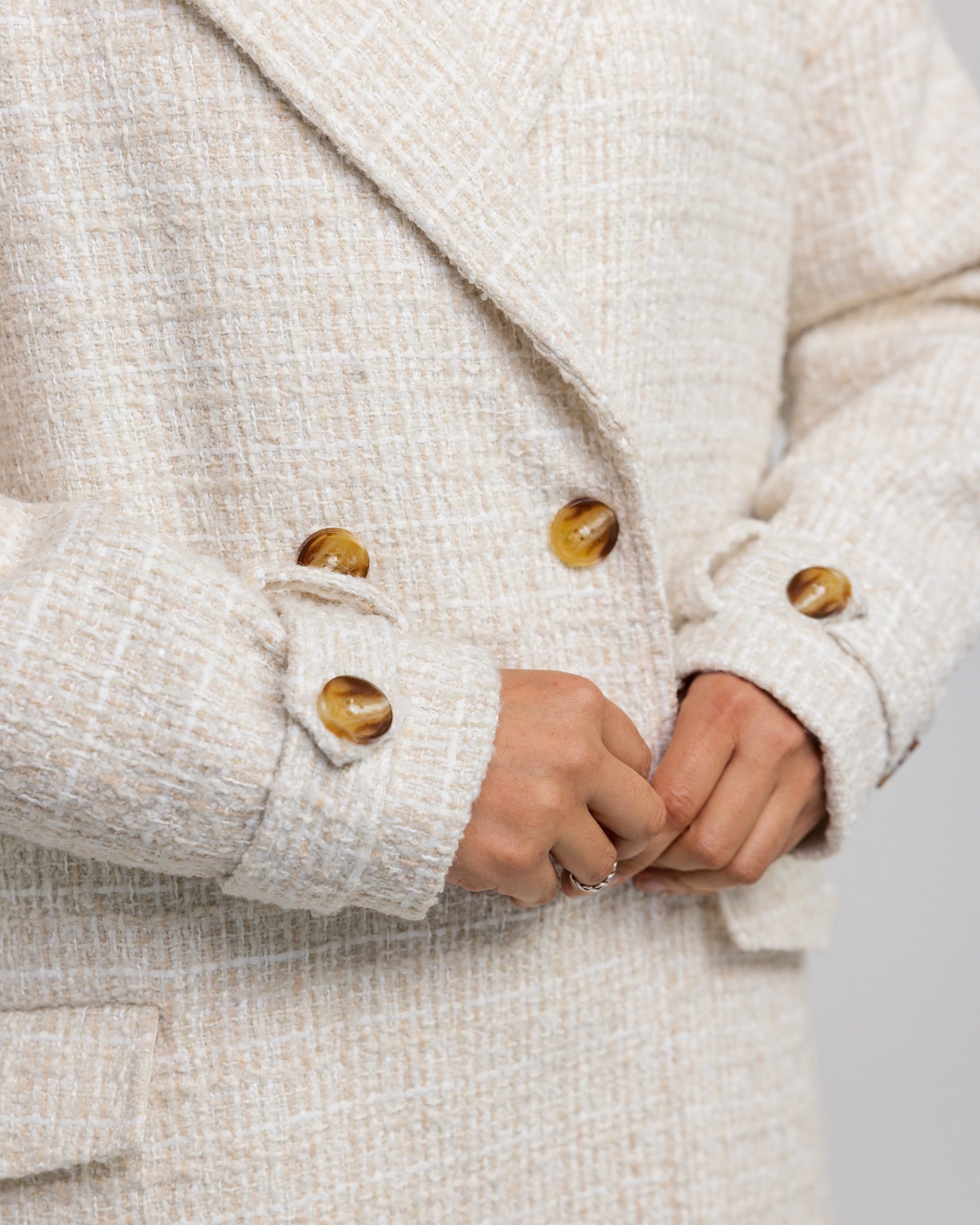 Trench-inspired outerwear abaya with an open front and relaxed, oversized feel.