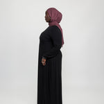 Fitted knit under dress with a clean finish, made to pair seamlessly with outer layers.
