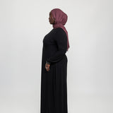 Fitted knit under dress with a clean finish, made to pair seamlessly with outer layers.