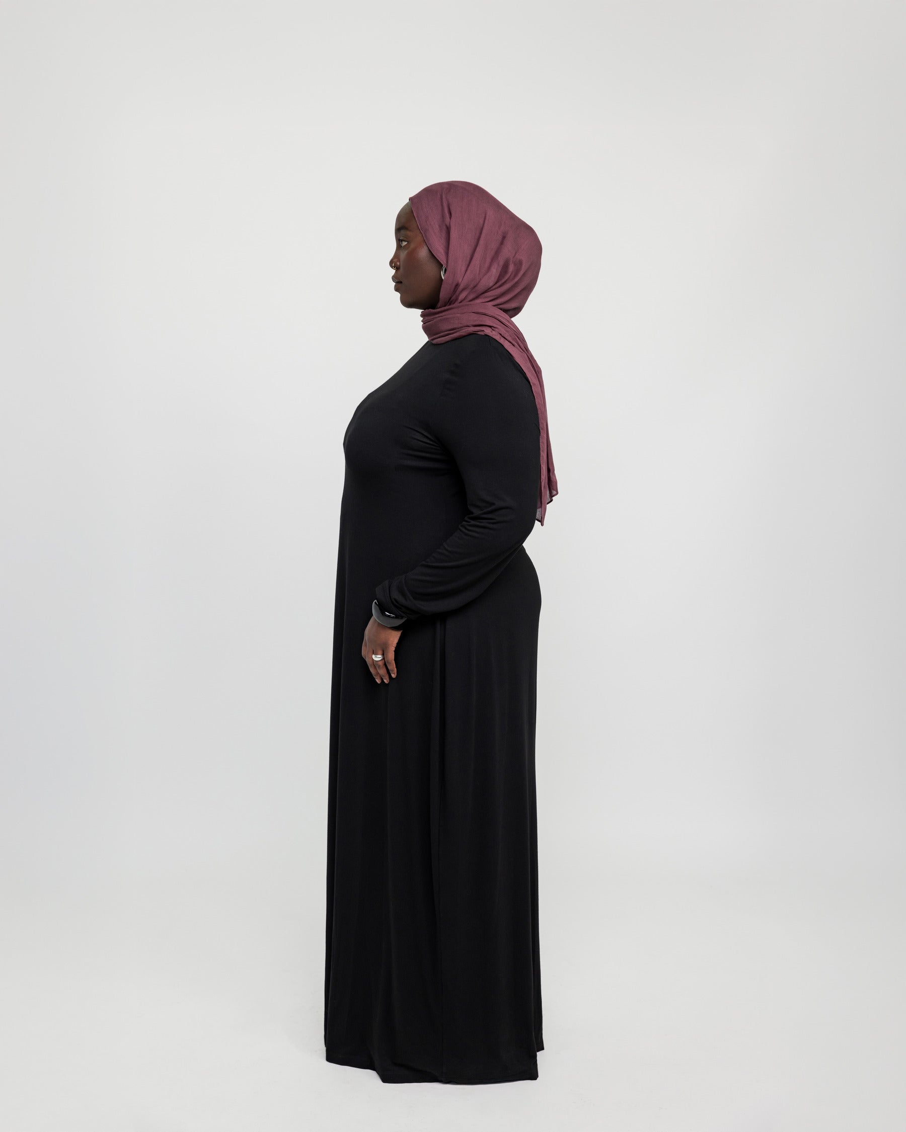 Fitted knit under dress with a clean finish, made to pair seamlessly with outer layers.