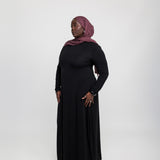 Layering under dress crafted from stretchy knit fabric for easy movement and coverage.