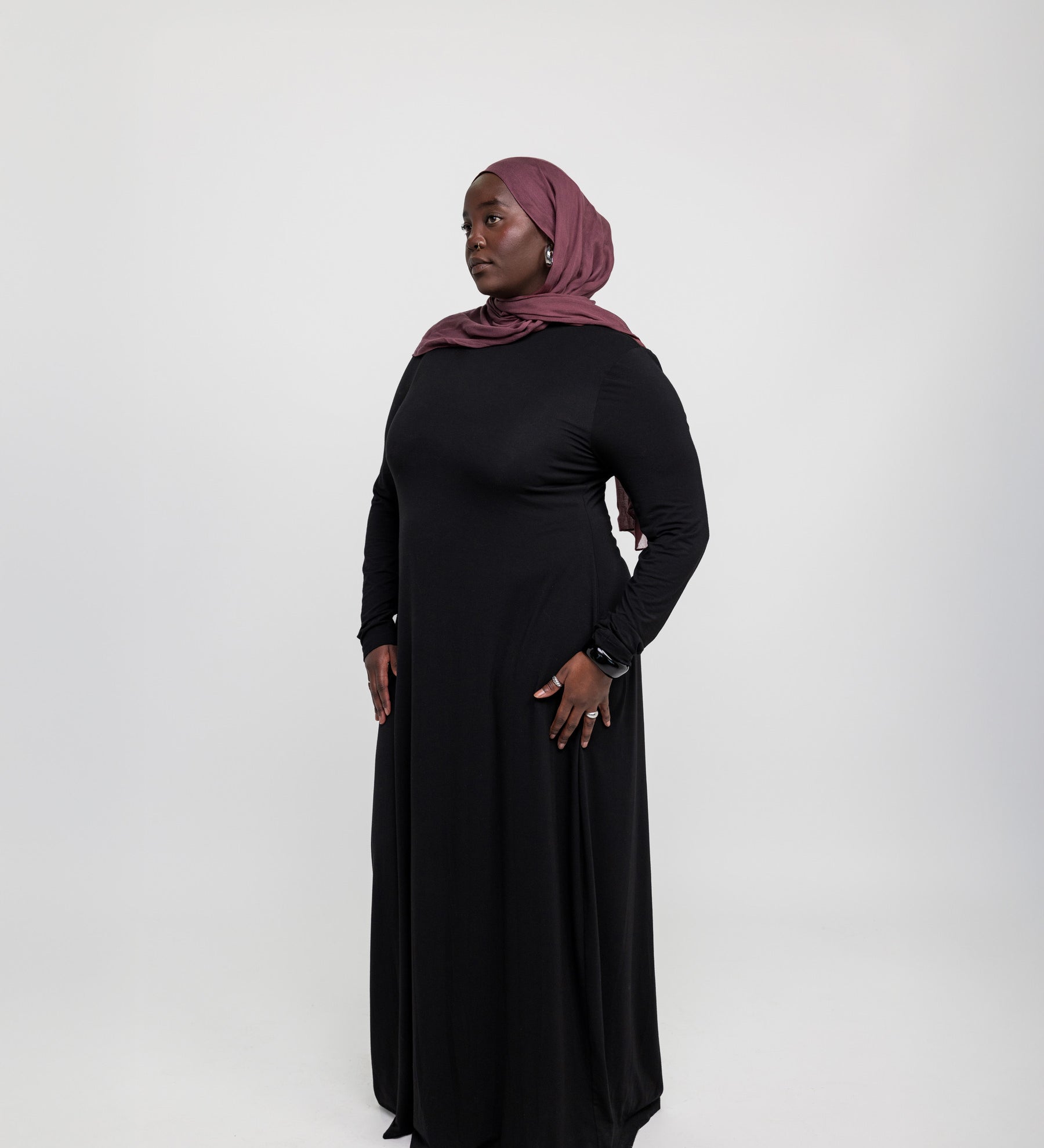 Layering under dress crafted from stretchy knit fabric for easy movement and coverage.