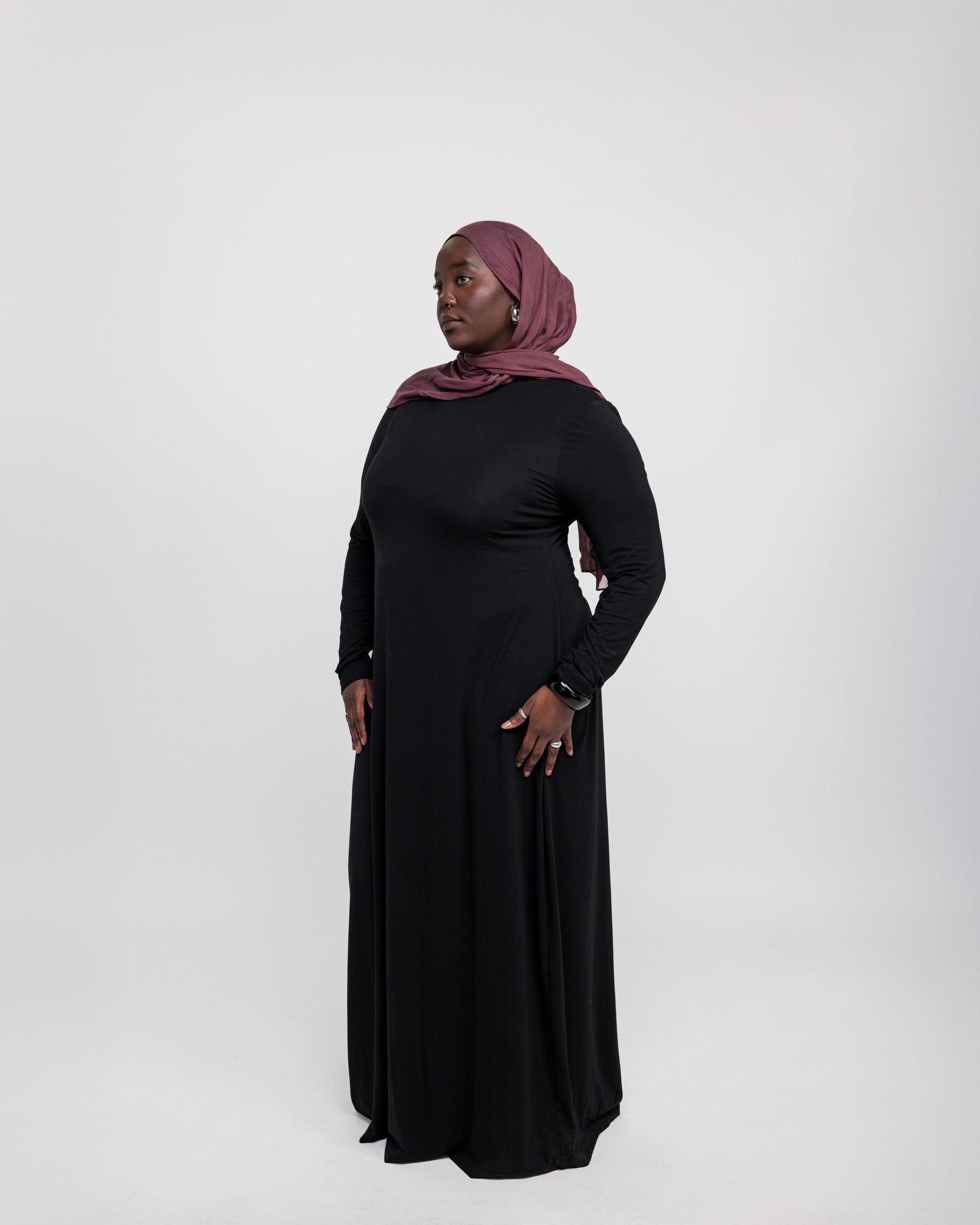 Layering under dress crafted from stretchy knit fabric for easy movement and coverage.