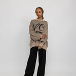 Modest knit sweater with a flowing, oversized shape and heritage-inspired design