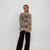 Modest knit sweater with a flowing, oversized shape and heritage-inspired design