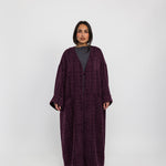 Oversized abaya crafted from tactile tweed, made for ease and modern modesty