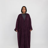 Oversized abaya crafted from tactile tweed, made for ease and modern modesty
