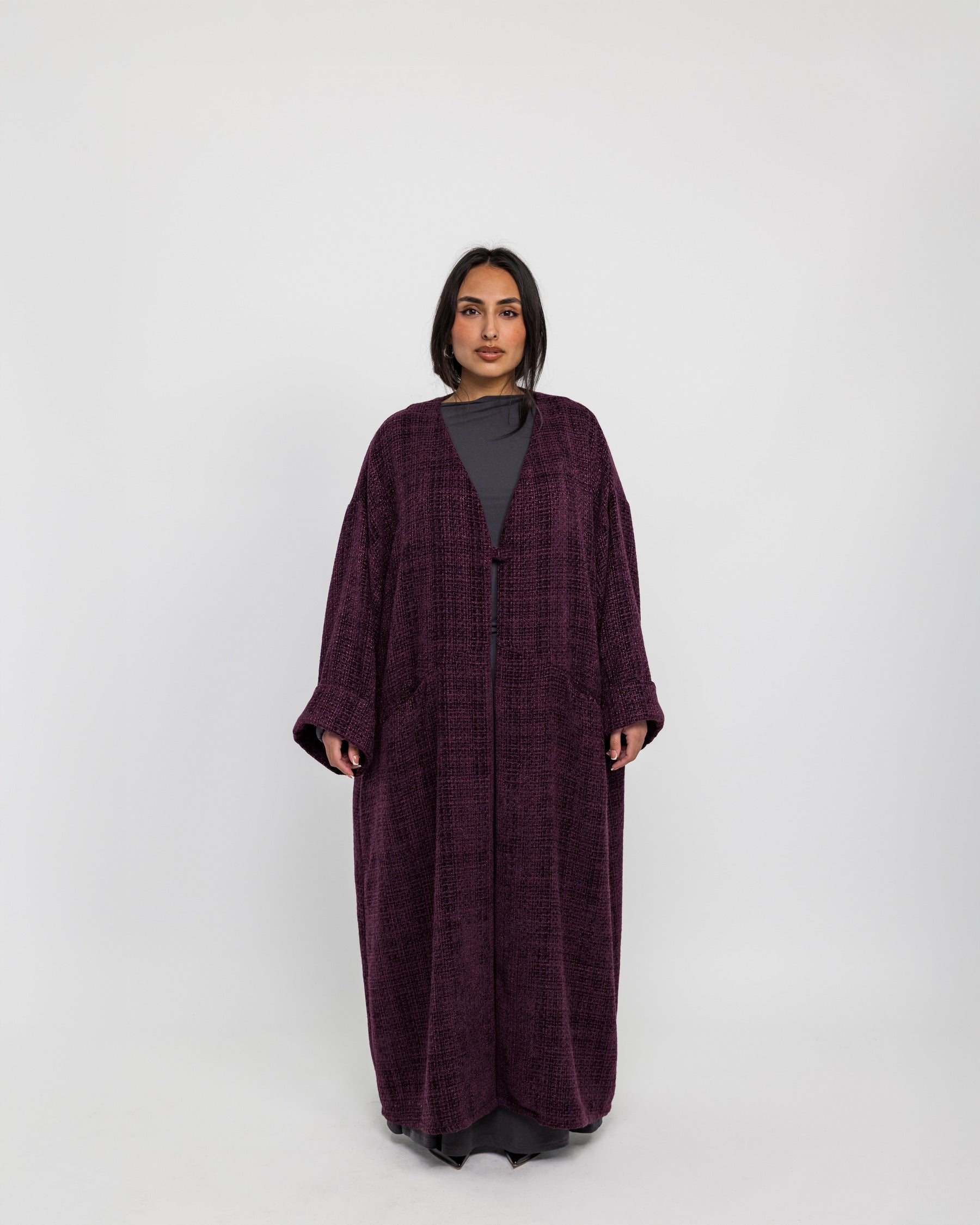 Oversized abaya crafted from tactile tweed, made for ease and modern modesty