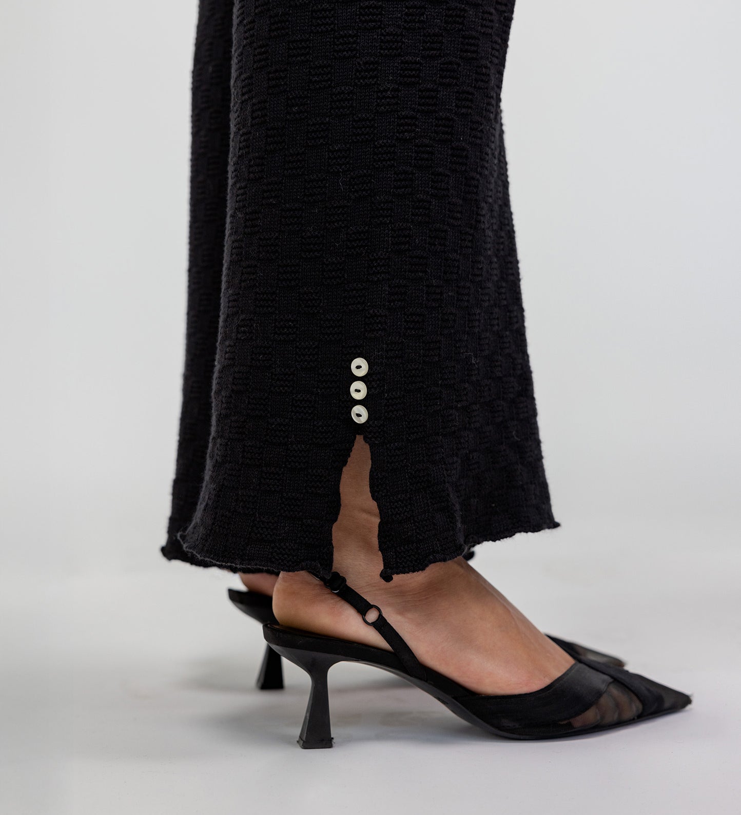Knit flare trousers with a close fit at the waist and a flowing, flared leg