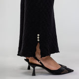 Knit flare trousers with a close fit at the waist and a flowing, flared leg