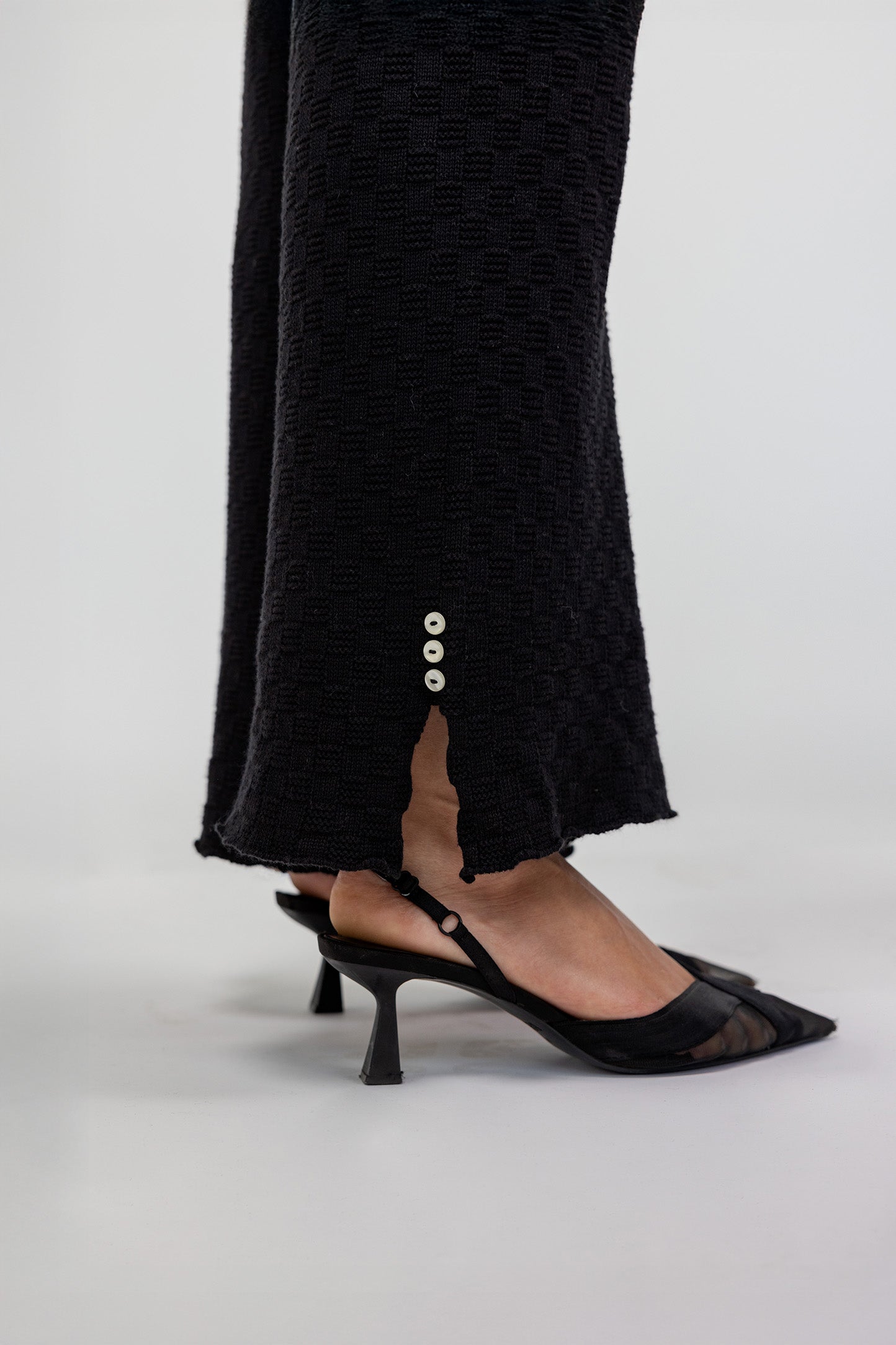 Knit flare trousers with a close fit at the waist and a flowing, flared leg