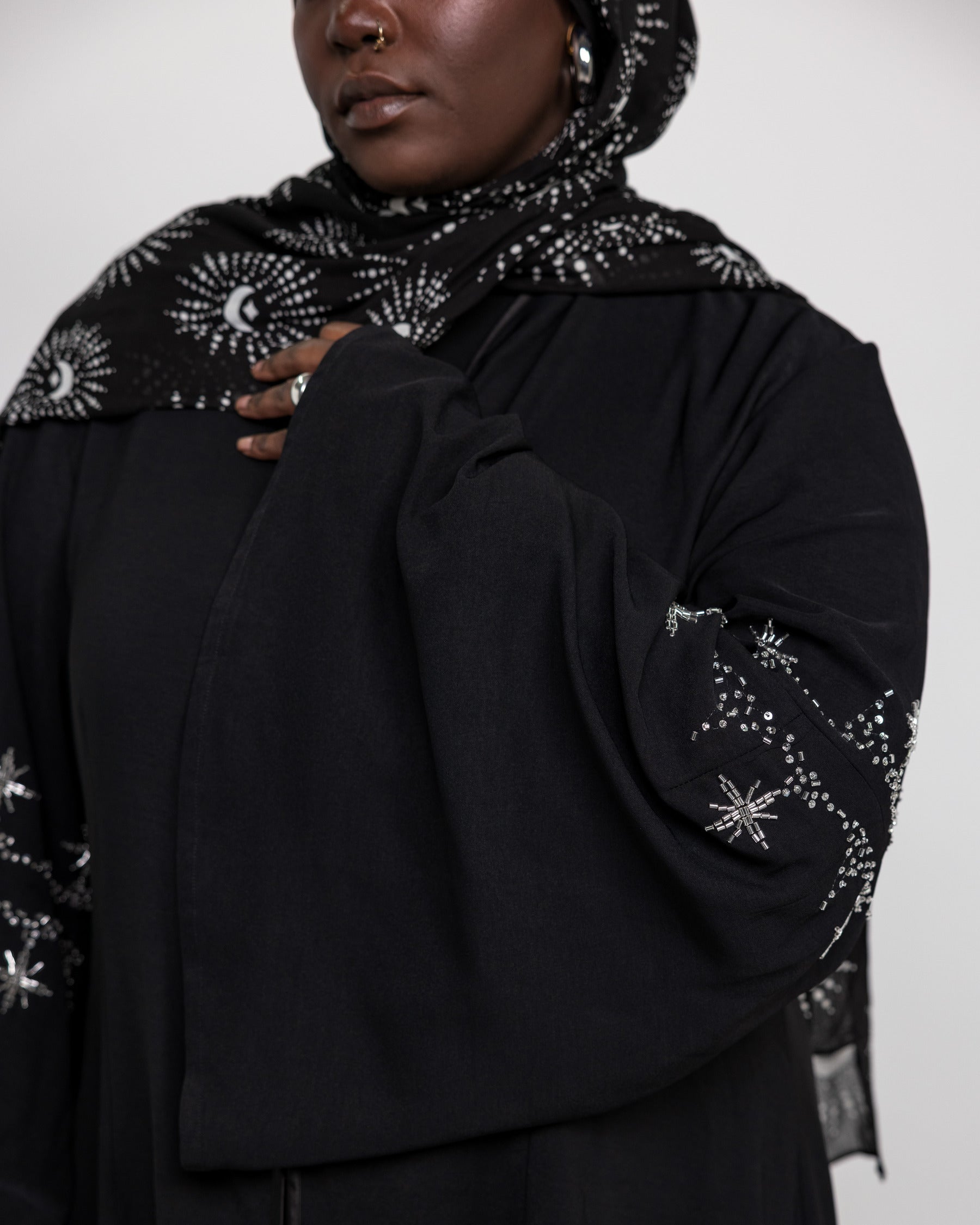 Flared sleeve abaya adorned with shimmering embellishments for a refined finish