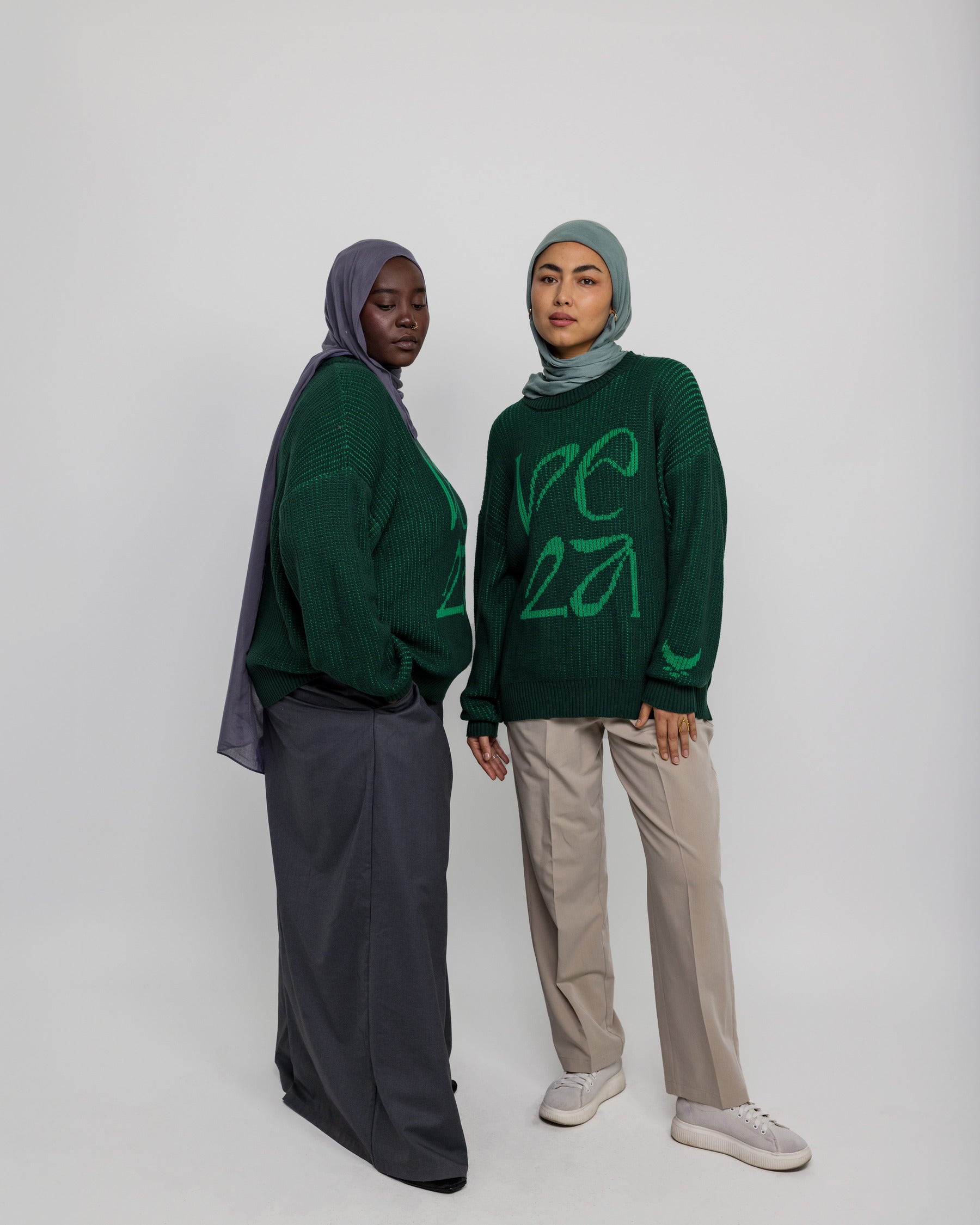 Soft oversized sweater with traditional pattern influence and modern comfort.