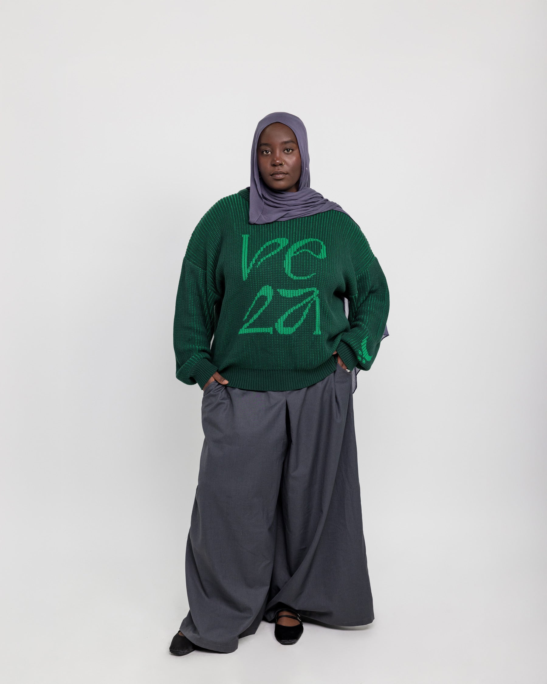Relaxed-fit sweater featuring intricate woven patterns and cozy, soft texture