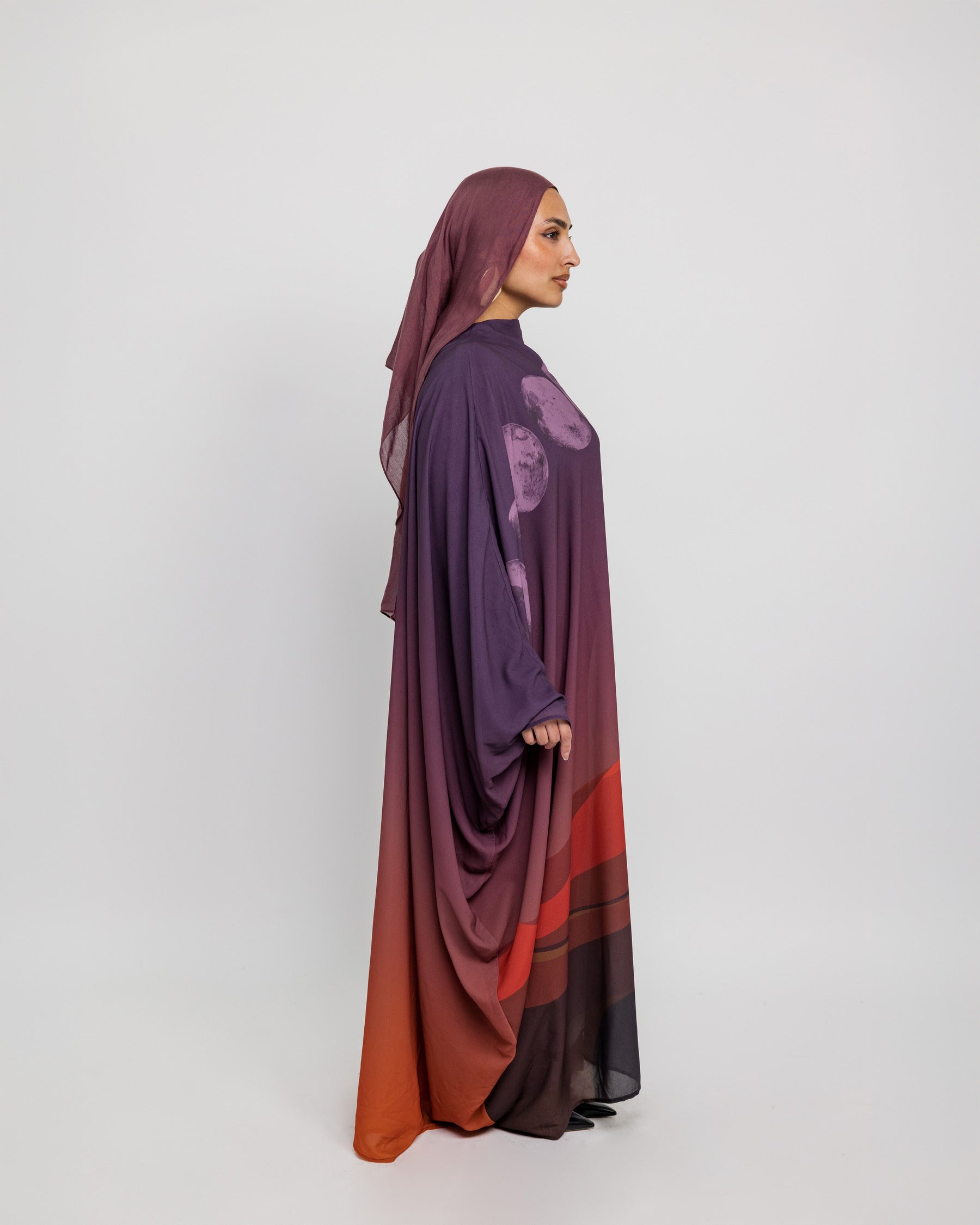 Sheer outer layer abaya with delicate moon phase artwork and graceful movement
