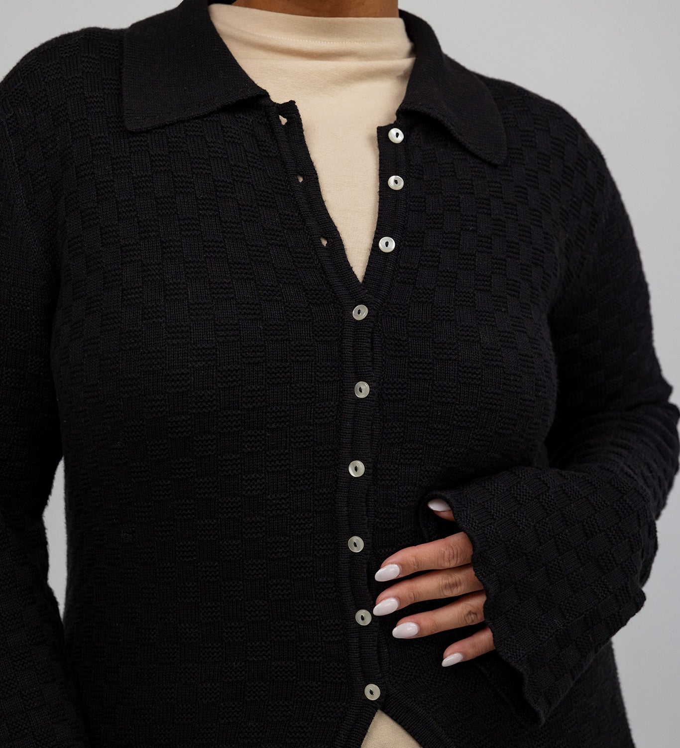 Lightweight cardigan with checkered texture, perfect for layering and everyday wear.