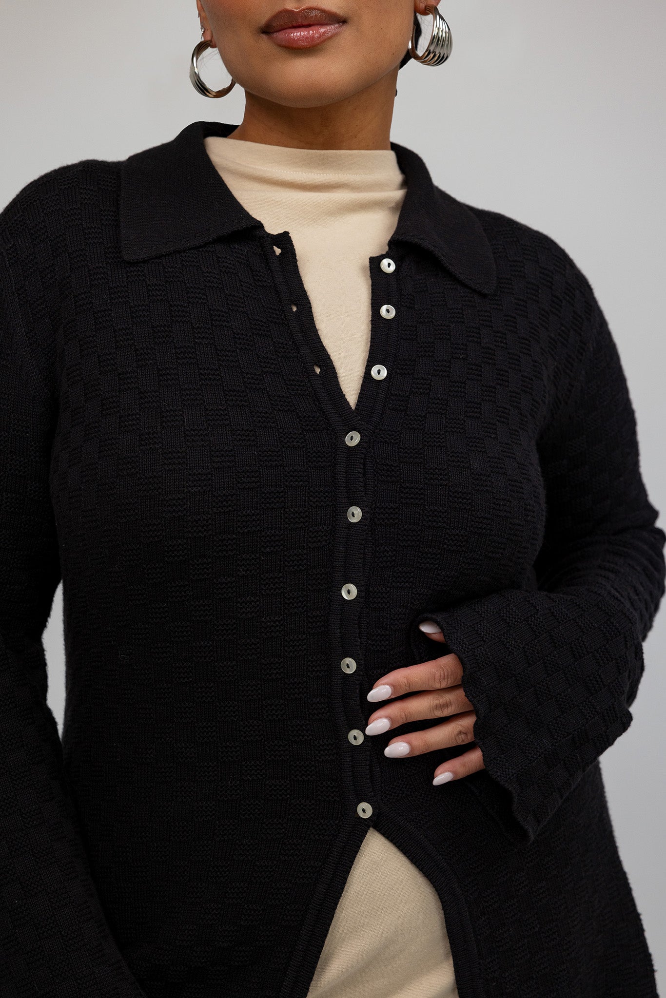 Lightweight cardigan with checkered texture, perfect for layering and everyday wear.
