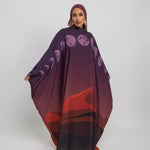 Desert-inspired kaftan abaya with flowing fabric and subtle moon details across the front