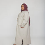 Layering abaya coat with trench-style lines and a modern, oversized shape