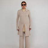 Fitted knit cardigan with a check pattern and modest full-length coverage.