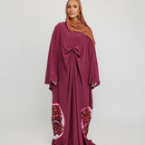 Flowing kaftan designed for special evenings, rooted in cultural symbolism and grace