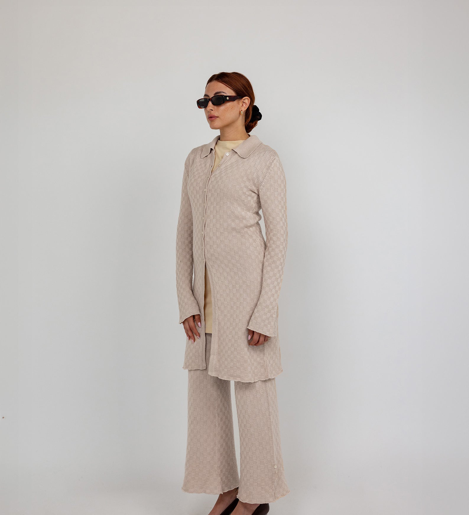 Comfort-fit flared pants with breathable stretch knit and a sleek, ankle-length cut.