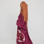 oftly structured kaftan designed with inspiration from traditional symbols of abundance