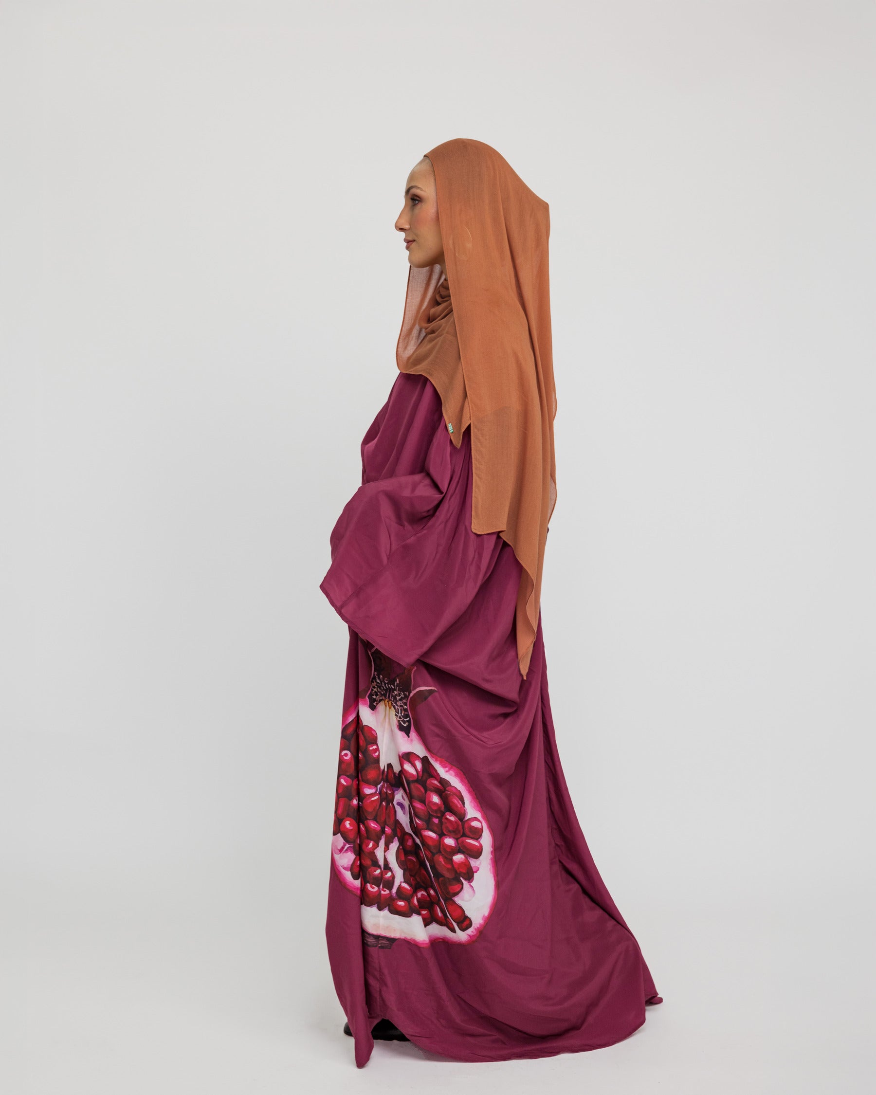 oftly structured kaftan designed with inspiration from traditional symbols of abundance