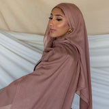 Blush hijab styled on a model.