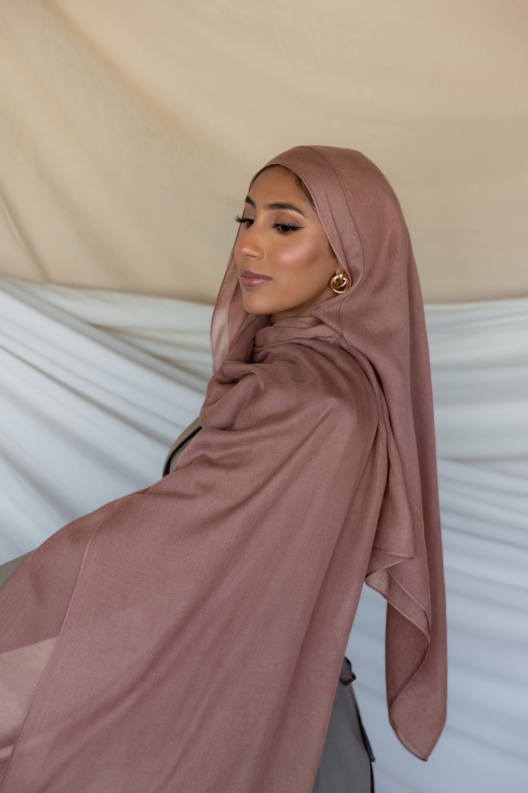 Blush hijab styled on a model.