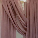 Blush hijab close up of product draped against backdrop.