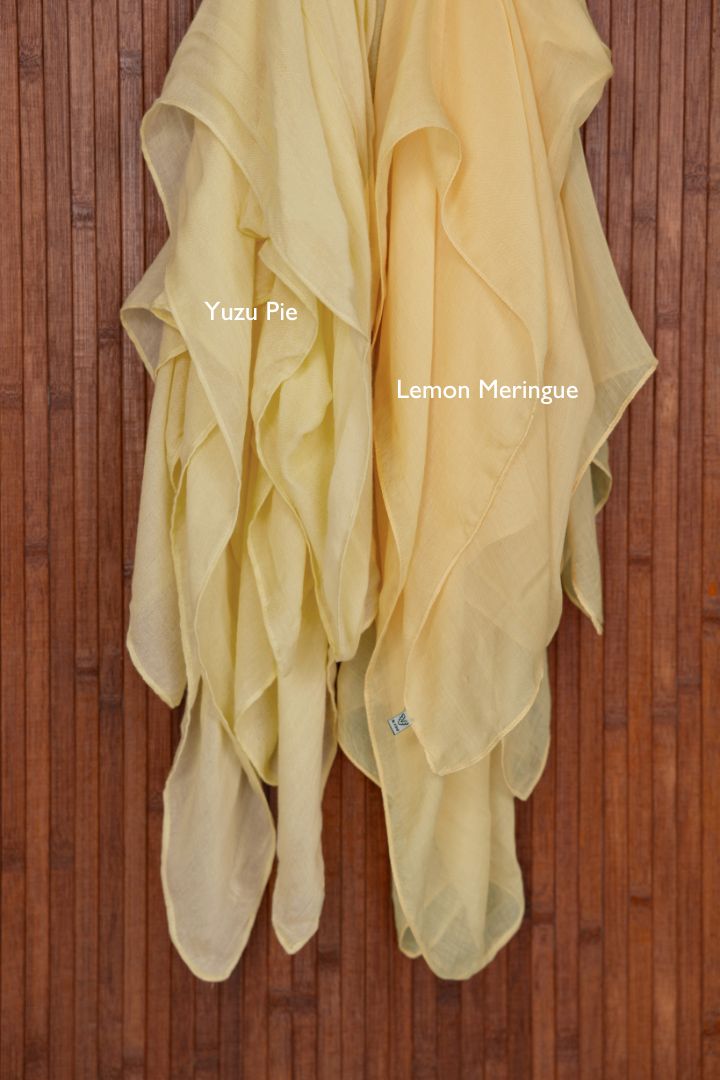 A cheerful, citrus-toned hijab from VELA in modal fabric, perfect for refreshing your wardrobe